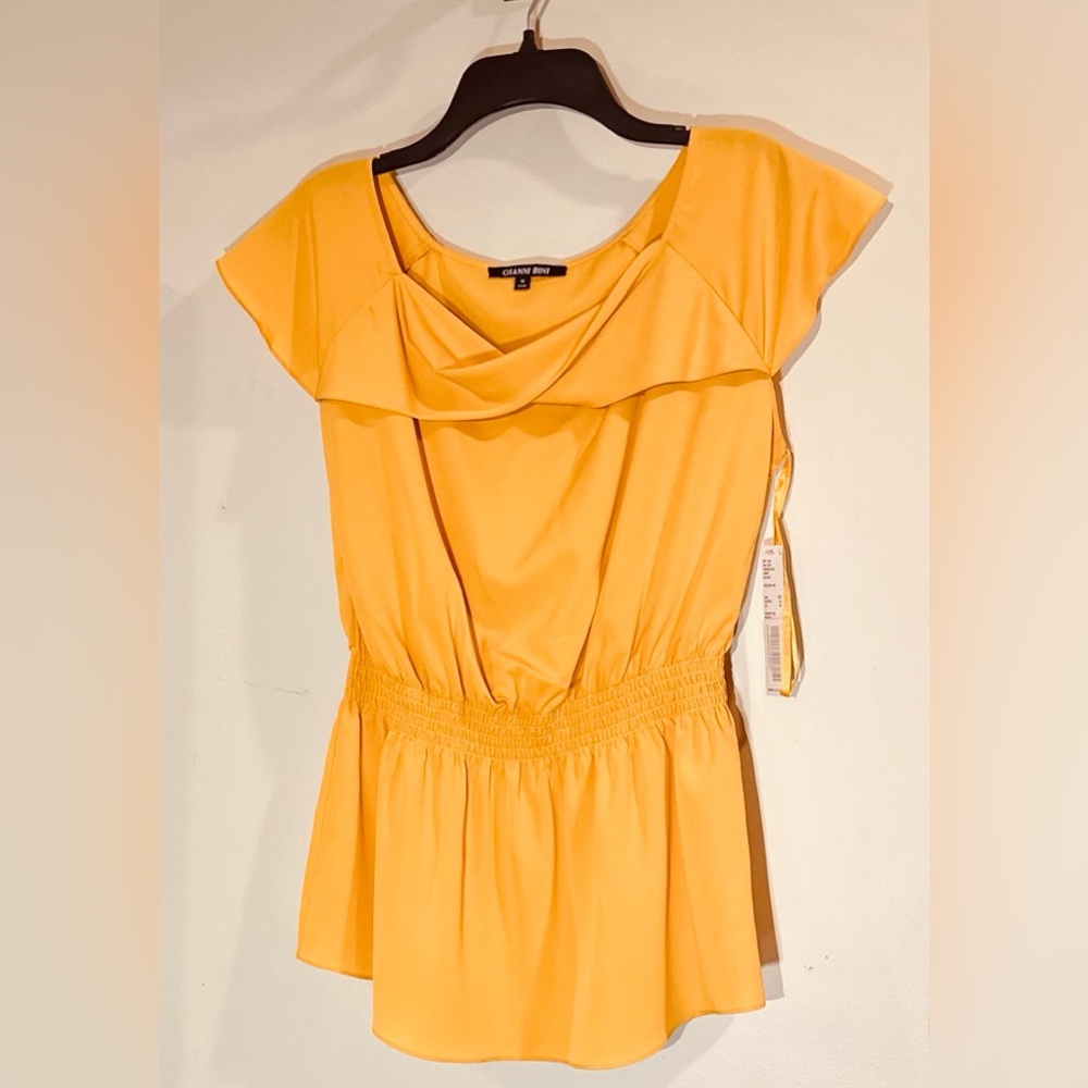 Gold/Yellow Gianni Bini blouse with fitted waist/peplum style.